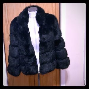 Short faux fur jacket.